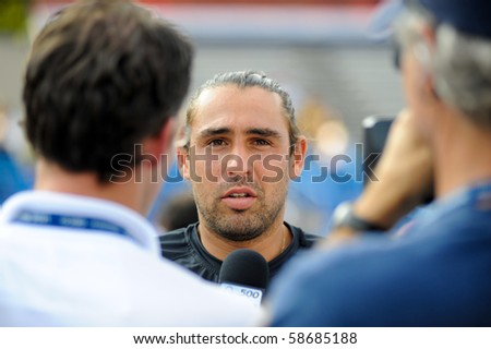 WASHINGTON - AUGUST 8: Marcos Baghdatis (CYP) speaks to reporters after losing to David Nalbandian (ARG, not pictured) in the finals of the Legg Mason Tennis Classic on August 8, 2010 in Washington.