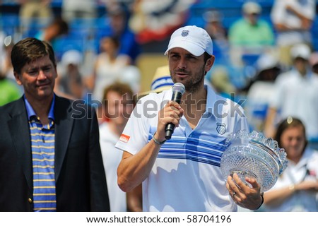 WASHINGTON - AUGUST 8: Mardy Fish (USA) speaks to the crowd after taking the doubles crown at the Legg Mason Tennis Classic on August 8, 2010 in Washington.