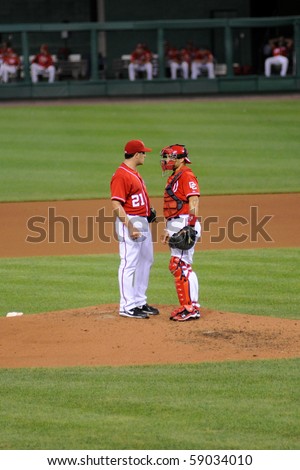 WASHINGTON - AUGUST 14: Pitcher Jason Marquis of the Washington Nationals confers with his catcher at the Nationals\' home game against the Arizona Diamondbacks on August 14, 2010 in Washington.
