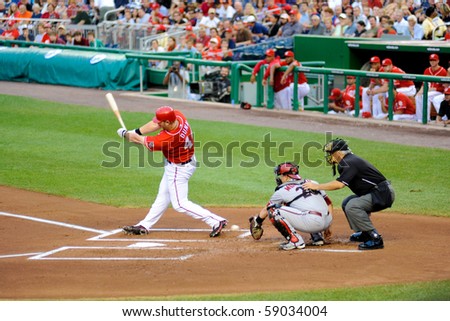 WASHINGTON - AUGUST 14: Adam Dunn of the Washington Nationals swings at a pitch in the Nationals\' home game against the Arizona Diamondbacks on August 14, 2010 in Washington.