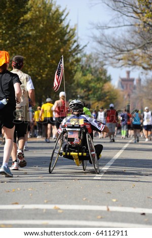 WASHINGTON- OCTOBER 31: A wheelchair athlete competes in the Marine Corps Marathon on October 31, 2010 in Washington, D.C.