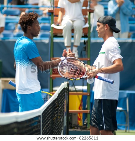 WASHINGTON - AUGUST 4: Top seed French Gael Monfils (L) and American Ryan Sweeting shake hands after their match at the Legg Mason Tennis Classic on August 4, 2011 in Washington.