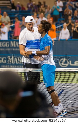 WASHINGTON - AUGUST 6: Gael Monfils (FRA) and John Isner (USA) shake hands after a close semifinal match at the Legg Mason Tennis Classic on August 6, 2011 in Washington.  Monfils advances to finals.