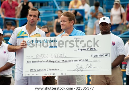 WASHINGTON - AUGUST 7: Radek Stepanek receives his check after defeating Gael Monfils (FRA, not pictured) to become the champion of the Legg Mason Tennis Classic on August 7, 2011 in Washington.