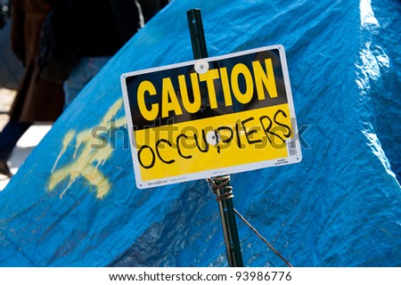 WASHINGTON, JAN. 30 – A sign at the Occupy DC site in Washington, DC. on January 30, 2012, the date on which police threatened to enforce a no-camping rule.