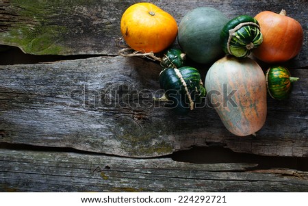pumpkins with copy space for note or congratulations on the old wooden background
