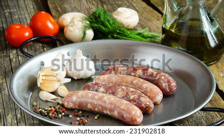 homemade raw sausages - chicken and beef sausages with garlic and spices.