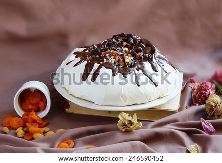 Pavlova cake with chocolate and dry fruits