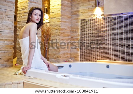 stock photo Girl in hot tub