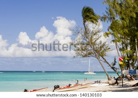 BAVARO, DOMINICAN REPUBLIC - APRIL 26: Unidentified tourists at the beach in Bavaro at April 26, 2013. Bavaro was developed together with the tourist region of Punta Cana, as a town for resort workers