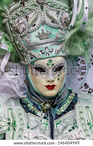 VENICE, ITALY - FEBRUARY 9: Unidentified person with Venetian carnival mask in Venice, Italy on February 9, 2013. At 2013 it is held from January 26th to February 12th.