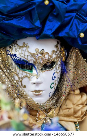 VENICE, ITALY - FEBRUARY 9: Unidentified person with traditional Venetian carnival mask in Venice, Italy on February 9, 2013. At 2013 it is held from January 26th to February 12th.