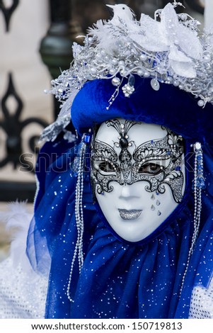 VENICE, ITALY - FEBRUARY 10: Unidentified person with Venetian carnival mask in Venice, Italy at February 10, 2013. At 2013 it is held from January 26th to February 12th.