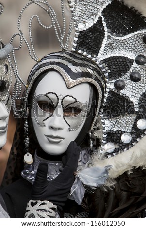 VENICE, ITALY - FEBRUARY 10: Unidentified person with traditional Venetian carnival mask in Venice, Italy on February 10, 2013. At 2013 it is held from January 26th to February 12th.