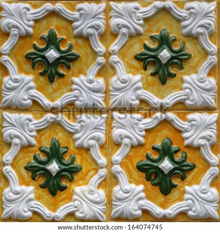 PORTO, PORTUGAL - SEPTEMBER 5: Traditional Lisbon azulejos on the facade of old building in Porto, Portugal on September 5, 2013. This art was introduced to Portugal by the Moors in 15th century.