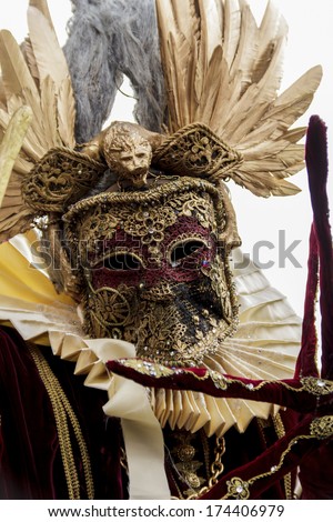 VENICE, ITALY - FEBRUARY 10, 2013: Unidentified person with Venetian carnival mask in Venice, Italy. At 2013 it is held from January 26th to February 12th.