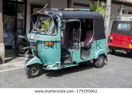 GALLE, SRI LANKA - JANUARY 24, 2014: Auto rickshaws or tuk-tuks on the street of Galle. Most tuk-tuks in Sri Lanka are a slightly modified Indian Bajaj model, imported from India.