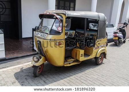 GALLE, SRI LANKA - JANUARY 24, 2014: Auto rickshaws or tuk-tuks on the street of Galle. Most tuk-tuks in Sri Lanka are a slightly modified Indian Bajaj model, imported from India.