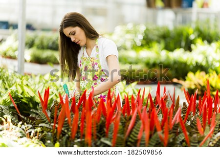 Young woman in flower garden