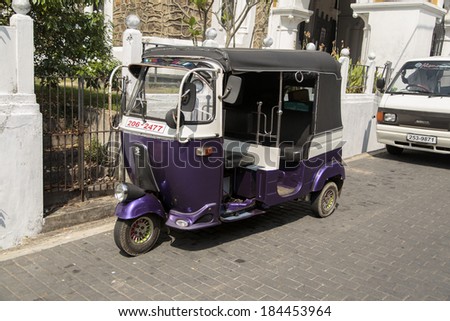 GALLE, SRI LANKA - JANUARY 24, 2014: Auto rickshaw or tuk-tuk on the street of Galle. Most tuk-tuks in Sri Lanka are a slightly modified Indian Bajaj model, imported from India.