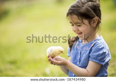 Cute girl with the chicken