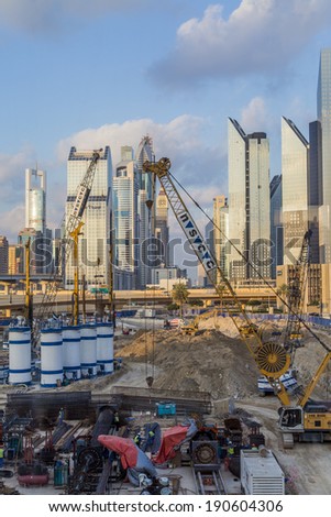 DUBAI, UAE - JANUARY 16, 2014: Construction site in Dubai. Due to the heavy construction in Dubai, 30,000 construction cranes, which are 25% of cranes worldwide, are operating in Dubai.