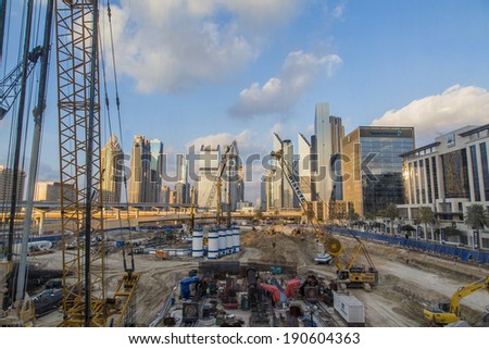 DUBAI, UAE - JANUARY 16, 2014: Construction site in Dubai. Due to the heavy construction in Dubai, 30,000 construction cranes, which are 25% of cranes worldwide, are operating in Dubai.