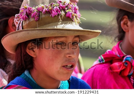 PISAC, PERU - MARCH 5, 2006: Unidentified woman at Inca citadel in Sacred Valley near Pisac in Peru. Sacred Valley of the Incas in the Southern Sierra contains many famous and beautiful Inca ruins