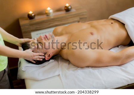 Young man having a facial massage