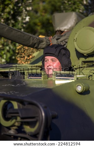 BELGRADE, SERBIA, OCTOBER 10, 2014: Unidentified soldier in Infantry Fighting Vehicle of Serbian Armed Forces. They are preparing for parade marking 70th anniversary of Belgrade liberation in WWII.