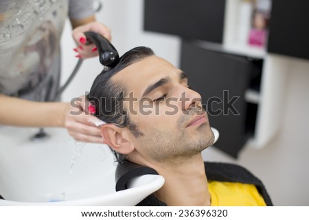 Young man at hairdresser