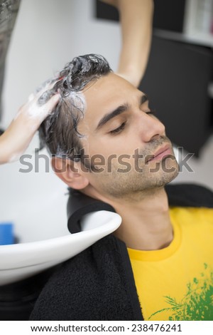 Young man at hairdresser