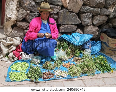 PISAC, PERU - MARCH 2, 2006: Unidentified woman at the market in Pisac. It is a Peruvian village in the Sacred Valley. The village is well known for its market every Sunday, Tuesday, and Thursday.