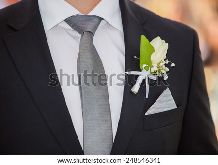Closeup detail of grooms suit