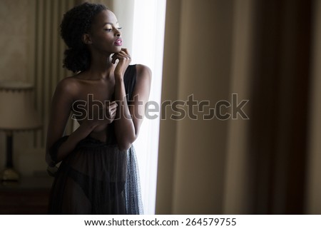 Young black woman in the room