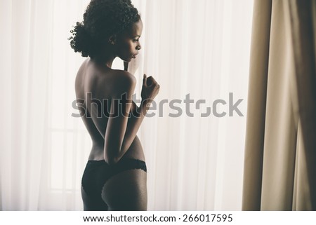 Young black woman in the room