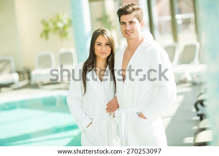 Young couple by the swimming pool