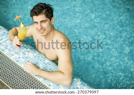 Young man in the swimming pool