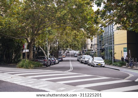 SYDNEY, AUSTRALIA - APRIL 9, 2015: Unidentified people on the street of Sydney, Australia. Sydney is the state capital of New South Wales and the most populous city in Australia.
