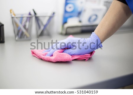 Woman at work, professional maid cleaning in dental office