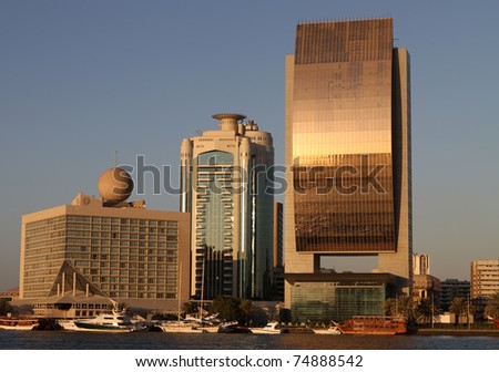 DUBAI, UAE - NOVEMBER 18: National Bank of Dubai building on Dubai Creek at November 18, 2010. At 125 metres, the National Bank of Dubai is the tallest building in Deira.