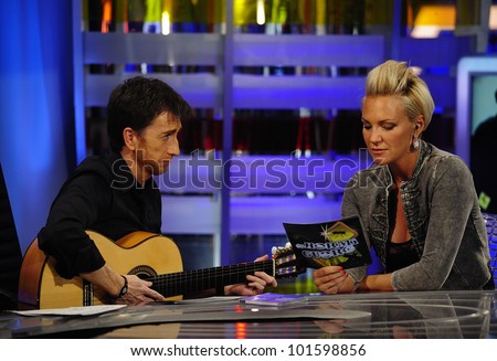MADRID - MAY 20: TV host Pablo Motos and singer Kate Ryan sing together at the Spanish TV show \