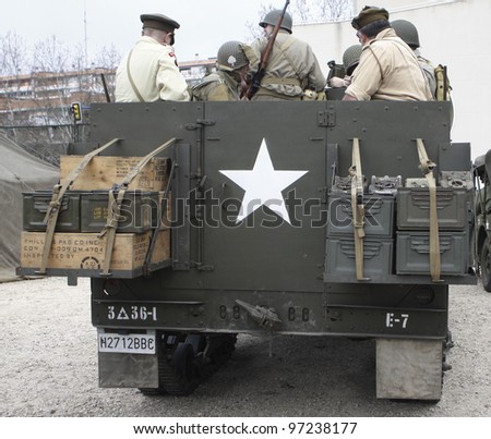 MADRID - MARCH 5: US Army soldiers and British soldiers on an US Army vehicle. Reconstruction of World War II by the \