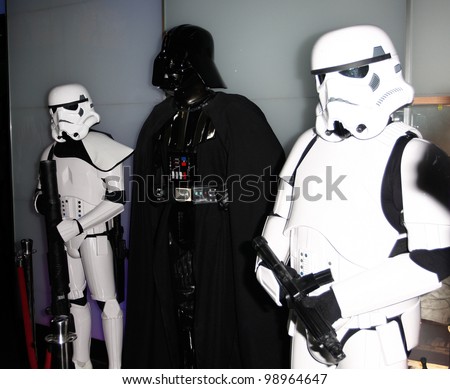 MADRID - MARCH 28: Darth Vader between two Storm Troopers. Star Wars exhibition during the presentation of the new Star Wars game for Kinect XBOX 360 at the Sports Palace on March 28, 2012 in Madrid