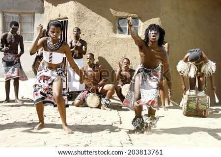 Africans dancing in a local village in Port Elizabeth, South Africa dancing and playing for tourists 11 April 2014