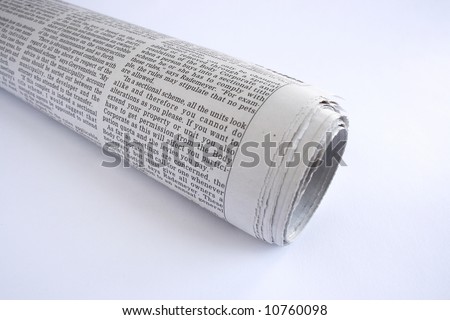 rolled up news paper giving some bad news