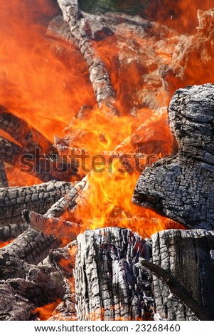 large wooden logs creating some intense heat and flames