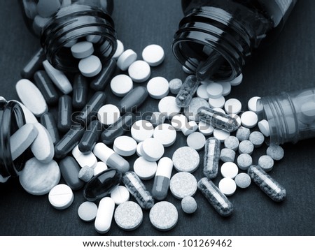 Pills spilling from bottles