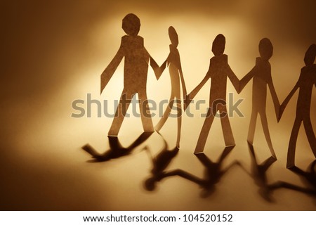 Paper doll cutouts holding hands