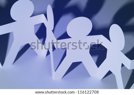 Team of paper chain people holding hands